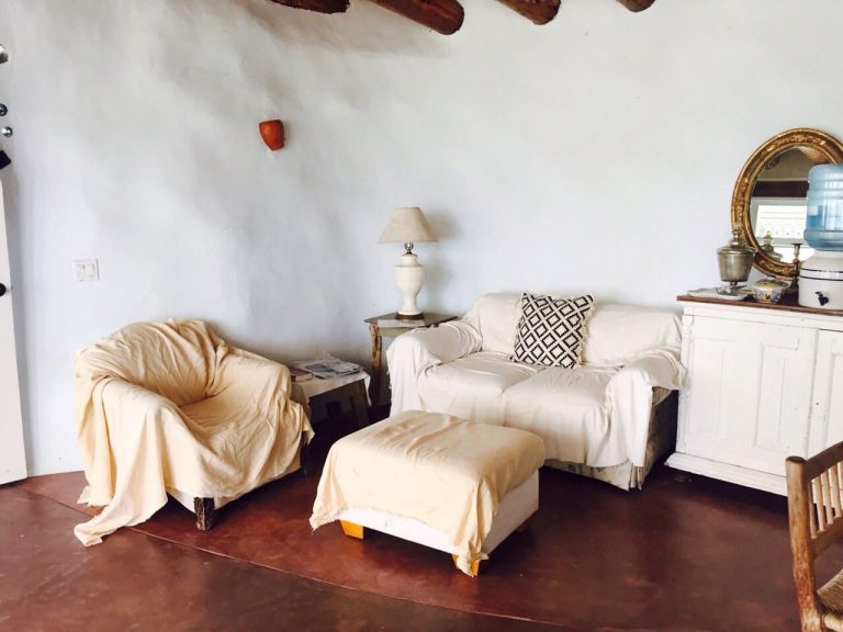 Sitting area and mirror in the Todos Santos Earthship