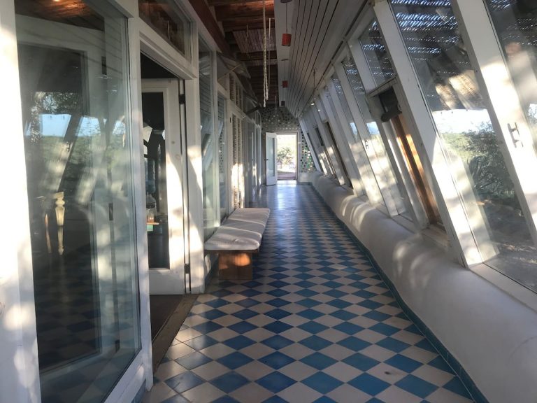 Sunlit greenhouse corridor along the Todos Santos Earthship