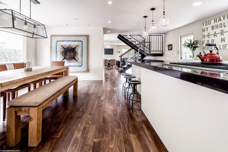 Bayliss Remodel open kitchen and dining area with long wood table and bench