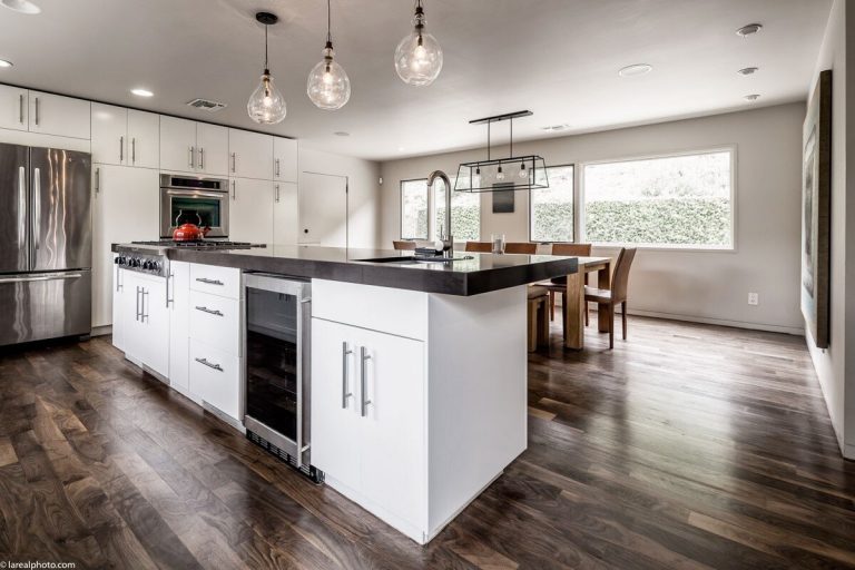Bayliss Remodel kitchen island with pendant lights and stainless appliances