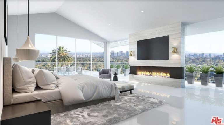 Nimes Private Residence main bedroom with fireplace and city view