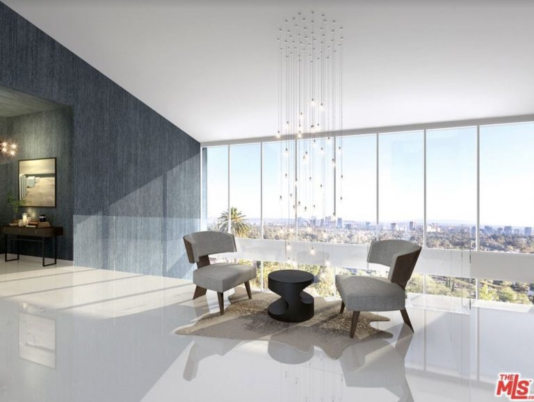 Nimes Private Residence lounge with a crystal chandelier and window wall