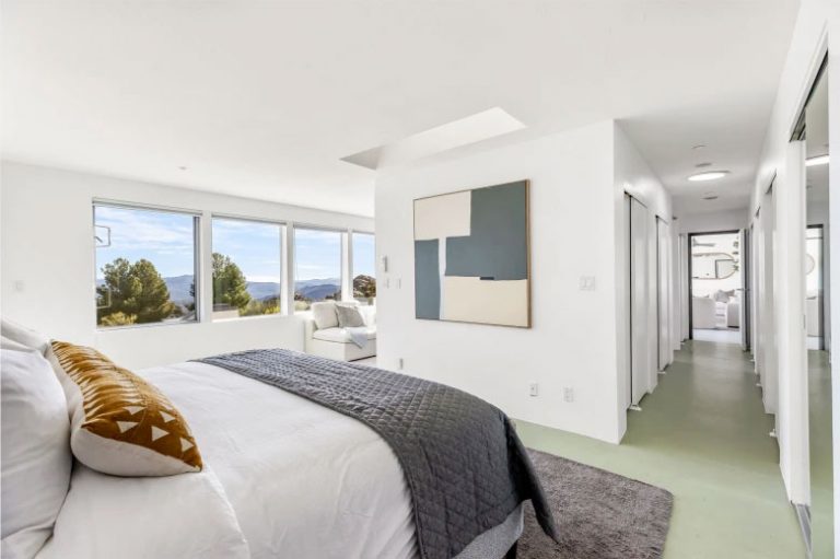 Bedroom in the West Hills Earthship concept house with hillside views