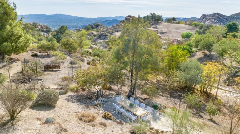 Aerial view of the West Hills, California property with native landscaping and boulders